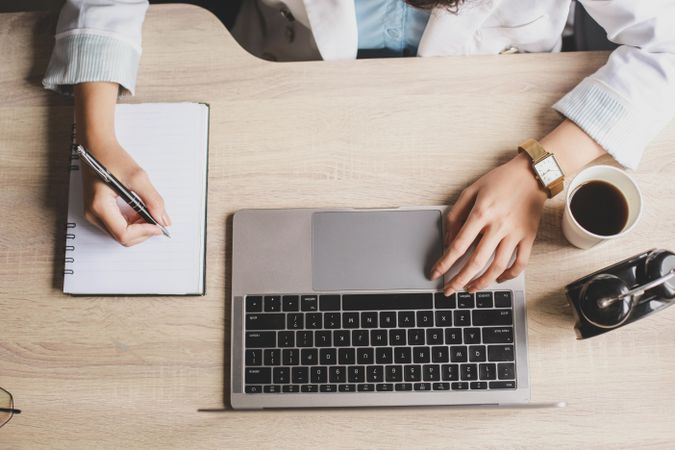 Businesswoman working on laptop in an office